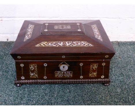 Rosewood casket shaped vanity box with mother of pearl flower and bird inlay, escutcheon, roundels and stringing, the lift-ou