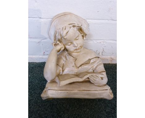 Plaster bust of girl reading book rested on cushion, indistinct impressed signature and number 612, height 26cm