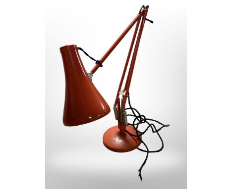 A Herbert Terry & Sons Limited red enamelled angle poised lamp