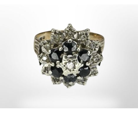 A 9ct gold sapphire and diamond cluster ring, size N CONDITION REPORT: 3.8g