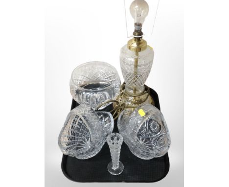 A brass and crystal lamp base, a fruit bowl, two baskets, and a further slender vase.