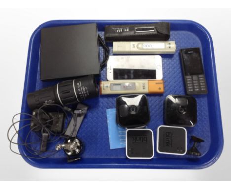 An Apple iPhone, Nokia phone, digital thermometer, Blink cameras, 16x52 monocular, portable DVD player, etc.