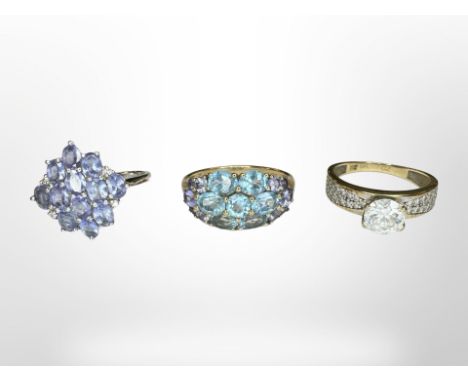 Three 9ct gold rings set with tanzanite and other gemstones CONDITION REPORT: 8.2g gross