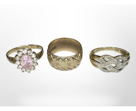A 9ct gold band ring and two further gem-set rings CONDITION REPORT: 8.2g gross
