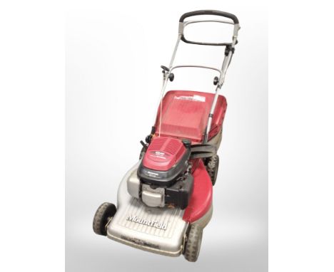 A Mountfield petrol lawn mower with Honda engine.