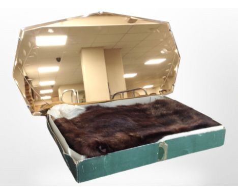 An Art Deco peach glass frameless mirror, width 55cm, together with a mink fur stole in Fenwicks box.