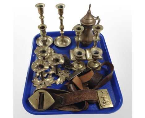 Several pairs of brass candlesticks, a leather belt and several buckles, cast-metal owl door knocker, etc.