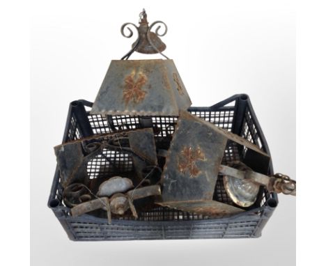 A group of weathered wrought-metal hanging light shades. (1 box)