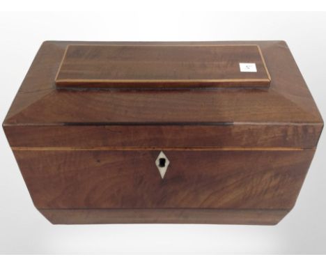 A mahogany sarcophagus tea caddy with two-division interior, width 23cm.