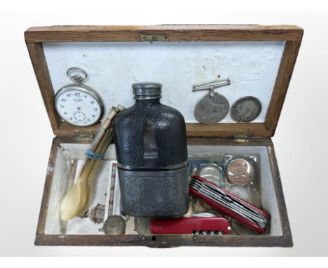 An oak box containing hip flask, Swiss army knives, carved horn spoons, pocket watch, George V  crown 1916 and other coins, W