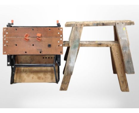 A pair of pine A-frame trestle table stands, together with a Workmate work bench.