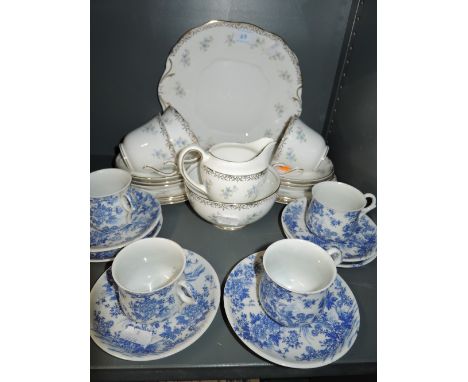 A selection of ceramics including blue and white tea cups and saucers