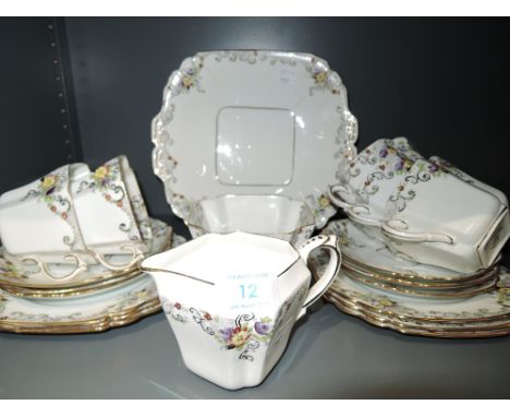 A part tea service marked Victoria c&amp;e with gilt edge work enamel detailing and cube style design