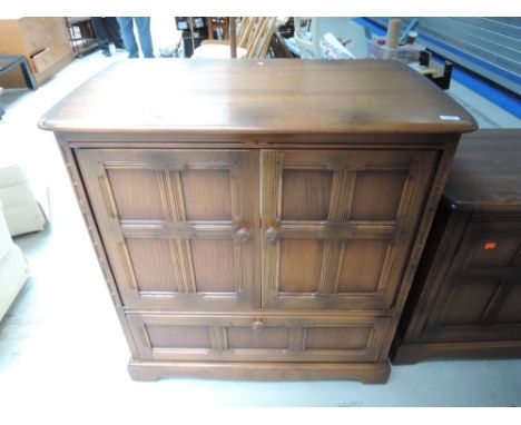 A modern Ercol mid dark stain TV cabinet