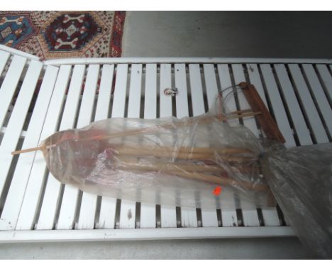 A selection of vintage seaside tools including fish pool nets