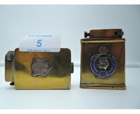 Two brass bodied cigarette lighters possibly home machined or engineered possibly military related one with enamel RAC badge