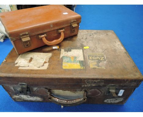 Two leather bound suitcase and tavel trunk bearing name badges etc