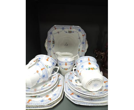 A part tea service by Royal Belgrave with blue and white print with enamel detailing 