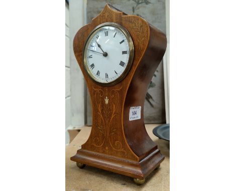 An Edwardian inlaid mahogany balloon top mantel clock with French drum movement 