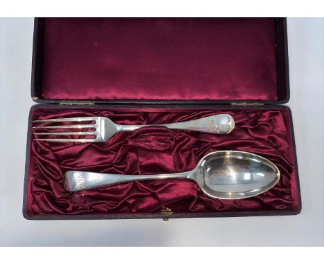 A cased monogrammed hallmarked silver table spoon and fork, London 1899, 3.5oz 