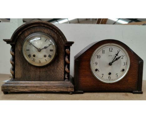 An oak cased Mantle Clock with barley twist columns &amp; another similar mantle clock. 