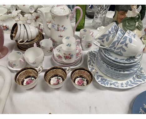 A Shelley 14 piece part coffee set decorated with bunches of flowers; a Paragon coffee sets of 6 cups and saucers, a Wedgewoo