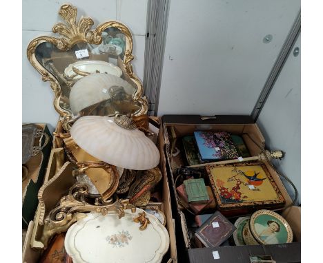 A gilt framed wall mirror, a large selection of gilt lacquer trays, a wall light fitting, decorative tins etc. 