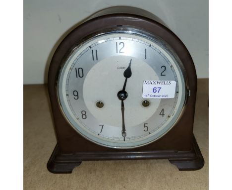 A 1930's Enfield Bakelite mantel clock with silvered dial 