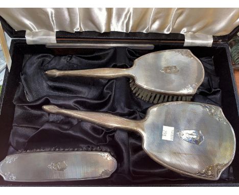 A hallmarked silver 3 piece dressing table set , engine turned and monogrammed, Birmingham 1959 