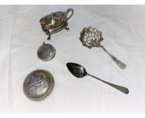 A continental white metal box with embossed landscape; a hallmarked silver sifter spoon; a hallmarked silver patch box, musta