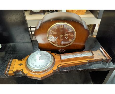 A 1930's chiming wall clock; a 1950's mantel clock by Smiths; a reproduction barometer in mahogany case 