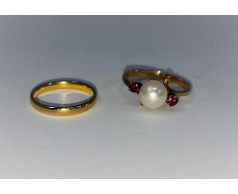 A 22 carat hallmarked gold wedding ring, 2.5 gm; a pearl and ruby set ring, stamped '14k' 