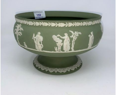A Wedgewood Jasperware green pedestal bowl decorated with classical scenes. 