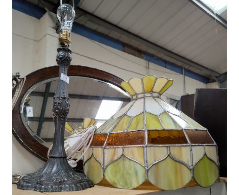 A Tiffany lamp and shade in green and cream; Art nouveau style stand. 