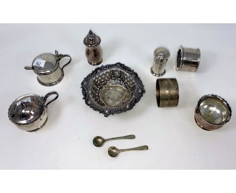 A hallmarked silver circular bonbon dish with pierced decoration, Sheffield 1902; a 3 2piece cylindrical cruet Birmingham 192