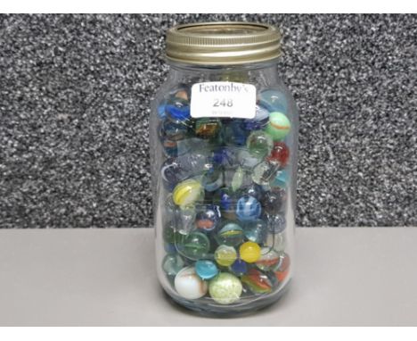 Vintage marbles of various sizes in a kilner jar