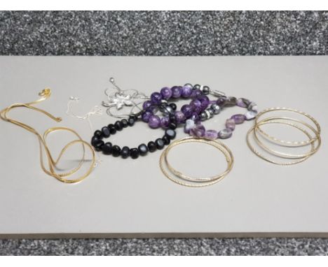 Two silver gilt bangles, silver chain, gold plated chain, two amethyst bracelets etc