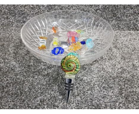 A glass bowl containing Murano glass cork and vintage Murano sweets