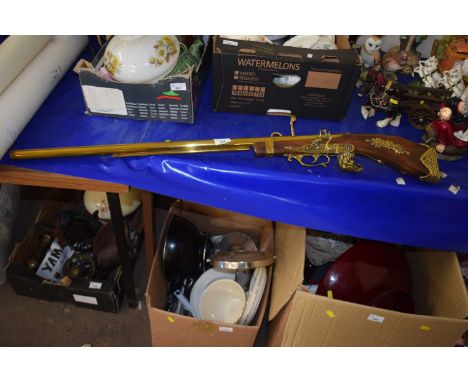 A decorative modern wall mounted model of firearm