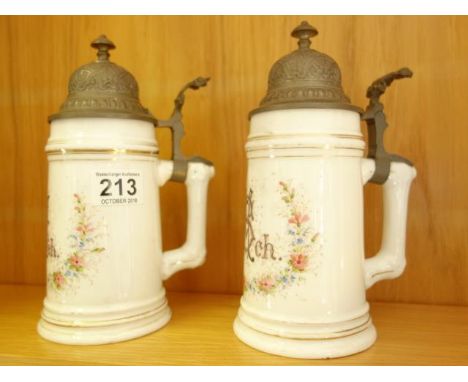 Pair of porcelain Biersteins each one with hand painted decoration over transfer, when held up to the light a Classical scene