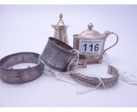 Sterling silver bangle 28 grams, engraved silver bangle London 1950's 44 grams, a 1931 napkin ring, a London 1902 mustard pot