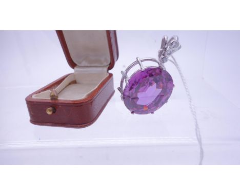 Superb large Amethyst coloured stone  and Diamond pendant set in a white GOLD cage style setting marked 750, total weight 48 