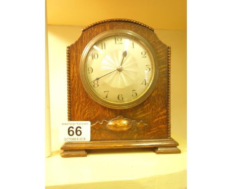 Miniature 1920's bracket style clock in an oak case with silvered dial 8 day movement dial marked Made in France 6.5" tall 6"