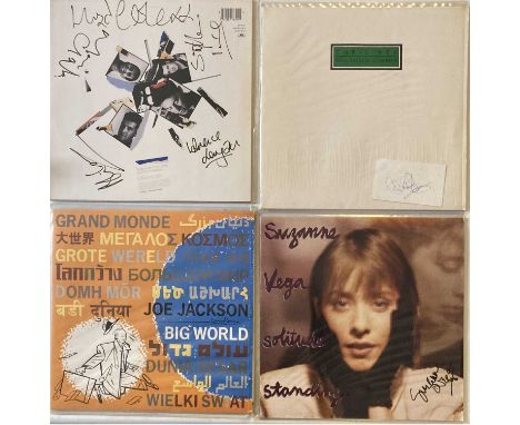 To include: Joe Jackson - Big World signed to reverse in marker pen by Joe Jackson, Suzanne Vega - Standby signed to front of