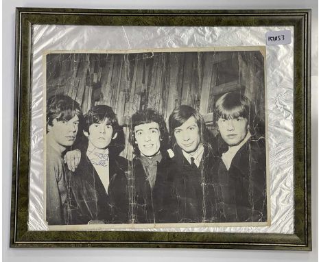 An early photograph of the Rolling Stones signed by Mick, Keith, Bill and Charlie. Photo measure 35 x 18cm. Authenticated by 