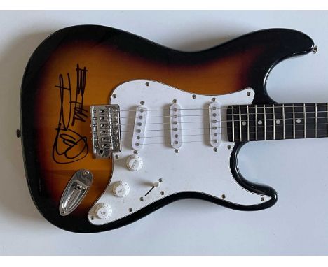 ROLLING STONES KEITH RICHARDS SIGNED GUITAR. Fullerton Strocaster-style electric guitar with sunburst finish that has been si