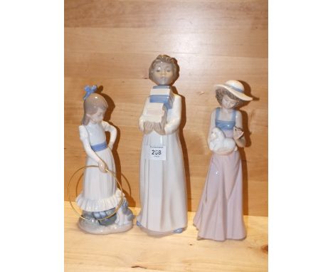 THREE NAO&nbsp;FIGURES COMPRISING BOY CARRYING BOOKS, A GIRL WITH A HULA HOOP AND A GIRL WITH A DOLL, ALL WITHOUT MODEL NUMBE