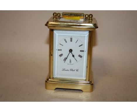 A VINTAGE BRASS CARRIAGE CLOCK BY LONDON CLOCK CO., WITH KEY, A/F