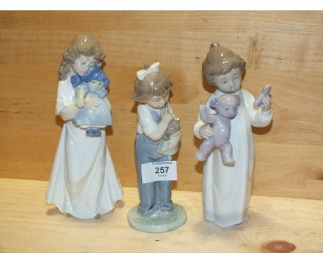 THREE NAO&nbsp;FIGURES OF CHILDREN WITH DOLLS AND A BEAR, ONE MARKED MODEL NUMBER 1424, THE OTHERS WITHOUT MODEL NUMBER