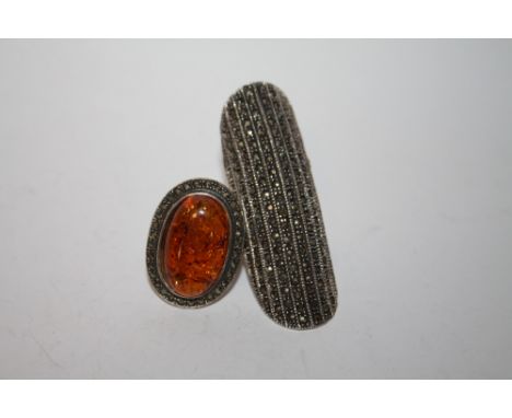 A LARGE SILVER AND MARCASITE RING TOGETHER WITH AN AMBER AND MARCASITE EXAMPLE 
